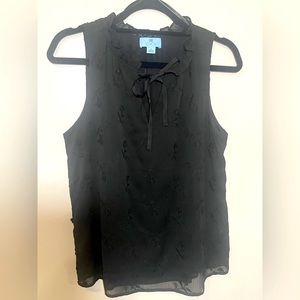 Black sleeveless Cece blouse with front tie size small